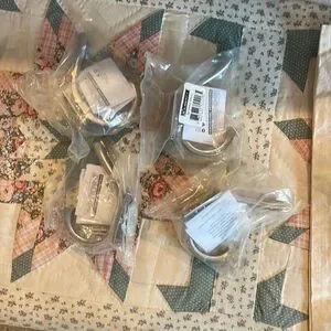 4 Unopened towel hooks from Lowes brushed nickel