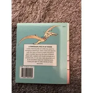 A Dinosaur Lives In My House By Nora Smith