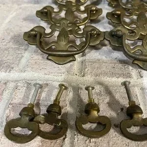 Antique Drawer Pulls With A Ornate Design