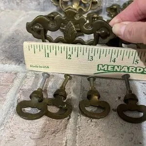 Antique Drawer Pulls With A Ornate Design