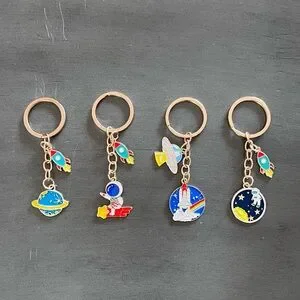 Astronaut Riding Surfing Rocket Spaceship Yellow Star Enamel 3.5" Gold Keychain