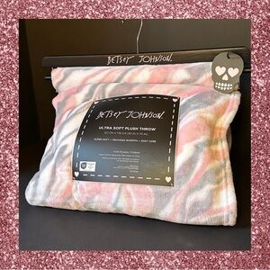 Betsey Johnson blanket with pink white and grey marble swirls