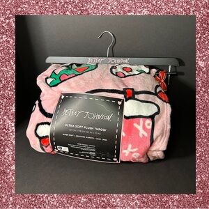 Betsey Johnson plush Christmas throw with stockings print