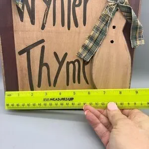 Primitive wooden snowman sign
