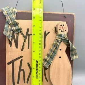 Primitive wooden snowman sign