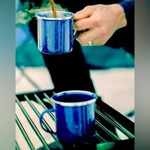Set of three enamel mugs. Each mug has a capacity of 350 ml and a shiny stainles