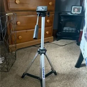 Silver And Black Tripod With Telescoping Legs And Quick-Release Locks