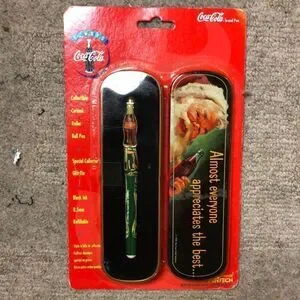 Vintage 1990’s Coca Cola Collectible Ceramic Roller Ball Pen and Santa Tin NEW