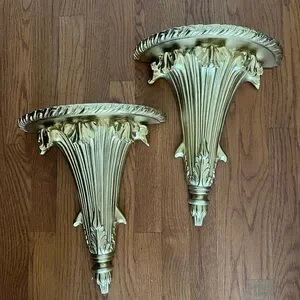 Vintage gold flute shaped sconces display shelves